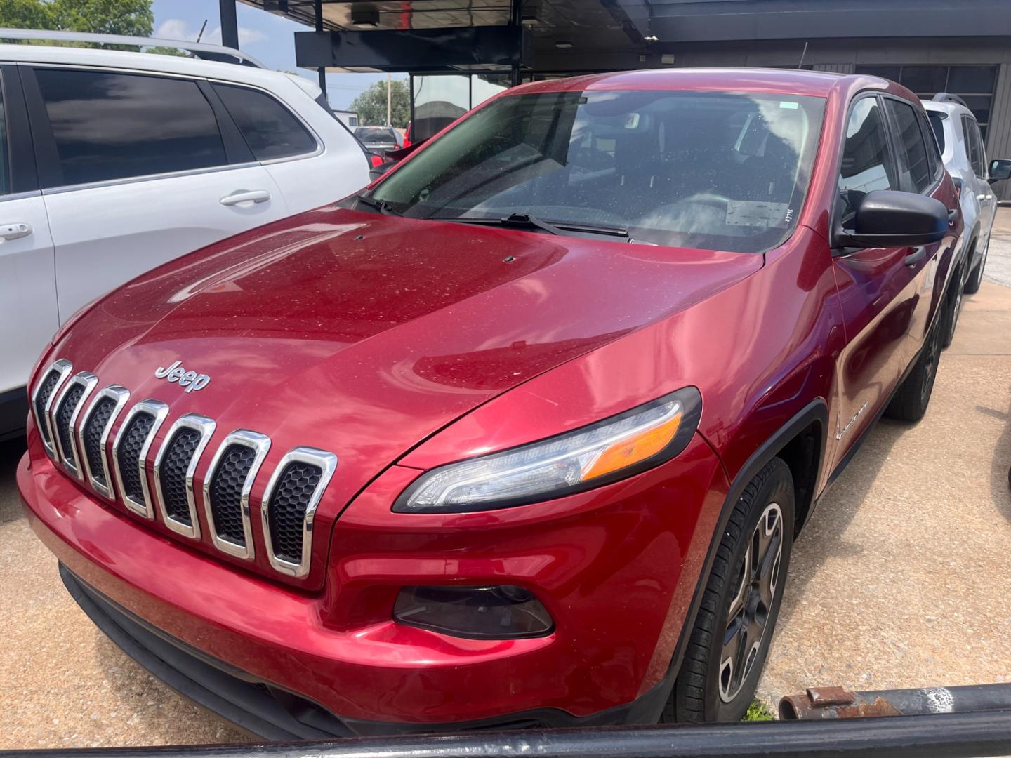 2016 RED JEEP CHEROKEE SPORT Sport FWD (1C4PJLAB5GW) with an 2.4L L4 DOHC 16V engine, 9A transmission, located at 8101 E. Skelly Dr., Tulsa, OK, 74129, (918) 592-3593, 36.121891, -95.888802 - Photo#0